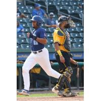 Kevonte Mitchell crosses the plate with the New York Boulders' final run in their opening game loss to Sussex County