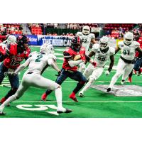 Sioux Falls Storm running Back Nate Chavious carries the ball against he Green Bay Blizzard