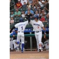 New York Boulders' Milton Smith, Jr, gets congratulations from teammate Zach Kirtley after hitting the first home run of his three-year professional career