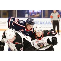 Vancouver Giants forwards Adam Hall (left) and Kyle Bochek vs. the Tri-City Americans