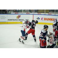 Springfield Thunderbirds left wing Nathan Walker (left) delivers a blow against the Hartford Wolf Pack