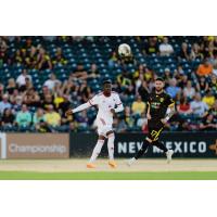 Phoenix Rising FC's Eddie Munjoma and Tampa Bay Rowdies' Greg Hurst in action