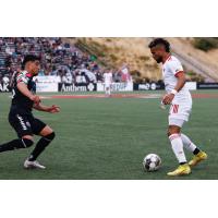 Phoenix Rising FC and the Oakland Roots in action