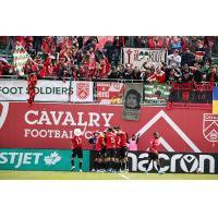 Cavalry FC celebrates in front of the home fans