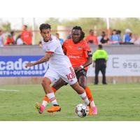 Phoenix Rising FC's Federico Varela and Rio Grande Valley Toros' Wahab Ackwei on the field