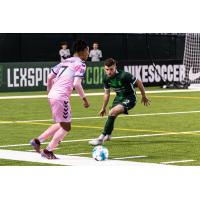 Lexington SC defender Tate Robertson (right) vs. Forward Madison