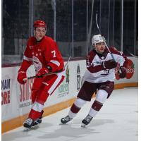 Peterborough Petes centre Tommy Purdeller (right) vs. the Soo Greyhounds