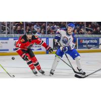 Rapid City Rush's Conner Bleackley and Wichita Thunder's Peter Bates in action