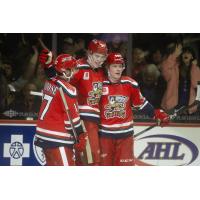 Grand Rapids Griffins' Taro Hirose, Simon Edvinsson, and Jonatan Berggren celebrate win