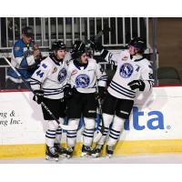 Wenatchee Wild forwards Conor Geekie (right) and Matt Savoie (center) gather with defenseman Graham Sward