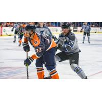 Wichita Thunder defenseman Nolan Kneen (right) vs. the Tulsa Oilers