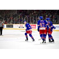 Kitchener Rangers' Lucas Ellinas, Trent Swick, and Hunter Brzustewicz on the ice