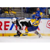 Vancouver Giants' Colton Roberts battkes Saskatoon Blades' Rowan Calvert