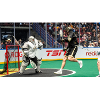 Calgary Roughnecks' Christian Del Bianco battles Vancouver Warriors' Jackson Suboch