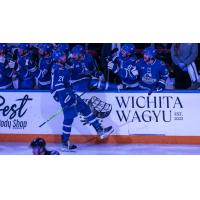 Wichita Thunder forward Jay Dickman along the team bench