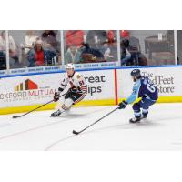 Rockford IceHogs defenseman Austin Strand (left)