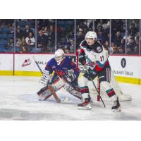 Kamloops Blazers' Dylan Ernst and Kelowna Rockets' Luke Schelter in action