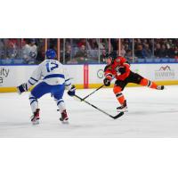 Wichita Thunder forward Peter Bates (left) vs. the Kansas City Mavericks