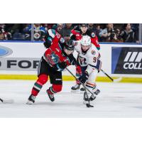 Kelowna Rockets centre Gabriel Szturc (left)