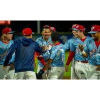 Tri-City Dust Devils, as the Rooster Tails, celebrate a walk-off victory