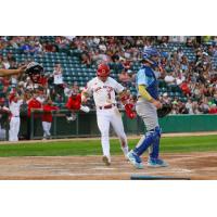 Andy Armstrong of the Winnipeg Goldeyes comes home to score