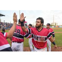 Riley Mahan of the Pensacola Blue Wahoos receives a high-five