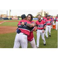 J.D. Osborne of the Pensacola Blue Wahoos is congratulated after a walk-off win