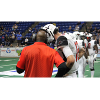 Jacksonville Sharks quarterback Connor Kaegi talks with coach James Fuller