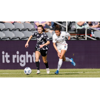 Racing Louisville FC forward Emina Ekic (left) vs. the North Carolina Courage