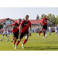 Cavalry FC react following a goal