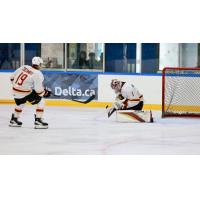 Vancouver Giants right wing Cameron Schmidt and goaltender Matthew Hutchison