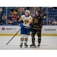 Saskatoon Blades defenceman Ben Saunderson (left)