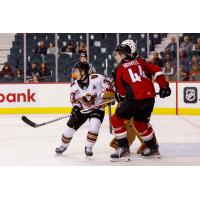 Vancouver Giants defenceman Marek Howell (right) vs. the Calgary Hitmen