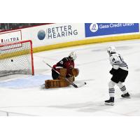 Wenatchee Wild forward Dawson Seitz (right) watches his shot fly past Vancouver Giants goaltender Burke Hood