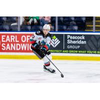 Ethan Mittelstadt of the Kelowna Rockets defends against the Spokane Chiefs