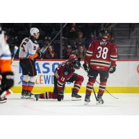 San Diego Gulls' Tyson Hinds and Tucson Roadrunners' Egor Sokolov and Aku Raty on game night