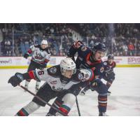 Kelowna Rockets' Rowan Guest and Kamloops Blazers' Ryan Michael in action