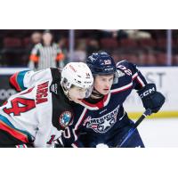 Kalder Varga of the Kelowna Rockets faces off with the Tri-City Americans