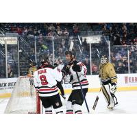 Youngstown Phantoms' Adam Benák and Peter Cisar and Muskegon Lumberjacks' Stephen Peck on game night