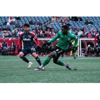 Hartford Athletic defender Jordan Scarlett (right)