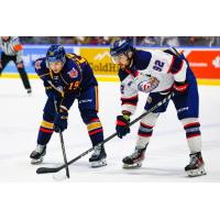 Saginaw Spirit right wing Nic Sima (right) faces off with the Barrie Colts