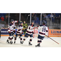 Saginaw Spirit congratulate Zayne Parekh after his 30th goal of the season