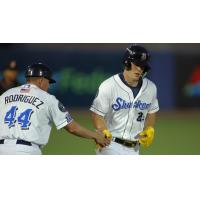 Biloxi Shuckers' Carlos Rodriguez congratuleates Brock Wilken