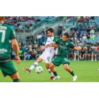 Oakland Roots SC's Tyler Gibson battles AV Alta FC's Harrison Robledo