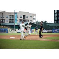 Greensboro Grasshoppers' Blake Butler congratulates Omar Alfonzo