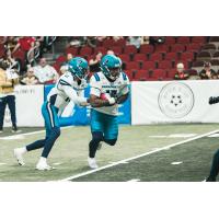 Massachusetts Pirates running back Tiyon Evans takes the handoff