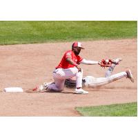 Ottawa Titans attempt to stop a Trois-Rivieres Aigles baserunner