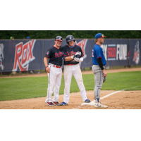Brady Ballinger of the St. Cloud Rox in congratulated on base
